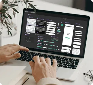 Bild eines MacBooks, auf dem einzelne Design-Komponenten zu sehen sind.